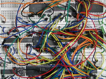 <strong>Breadboard with digital circuits and interconnections.</strong>