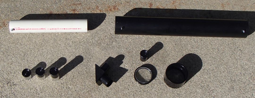 <strong>Top:</strong> The focusing slider tube and main telescope tube.
<strong>Bottom:</strong> Set of three eyepieces (6, 12.5, 20 mm), star diagonal, objective lens and the 16 mm eyepiece that comes with it if you get the objective/eyepiece bundle, dewcap - a PVC coupling.